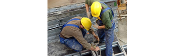 Photo of construction workers on a job site